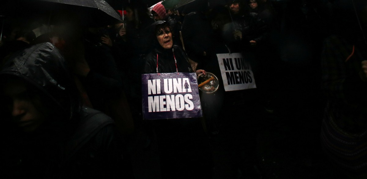 A woman shouts slogans as she carries a sign that reads "Not another (woman) less" during a demonstration to demand policies to prevent gender-related violence in Buenos Aires, Argentina, October 19, 2016. REUTERS/Marcos Brindicci