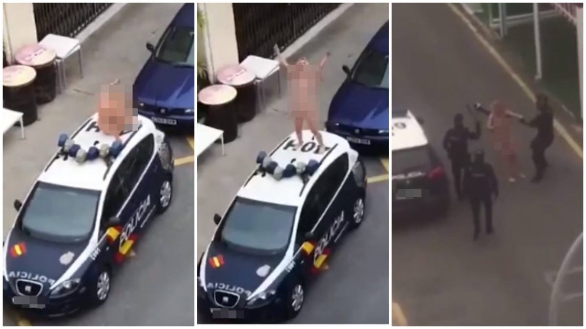 La mujer que se ha desnudado y subido a un coche de la Policía Nacional.